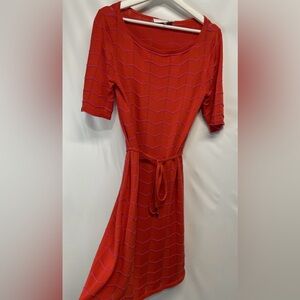 Trina Turk belted Chevron Knit dress. Coral/red with pink chevron stripe. Small.
